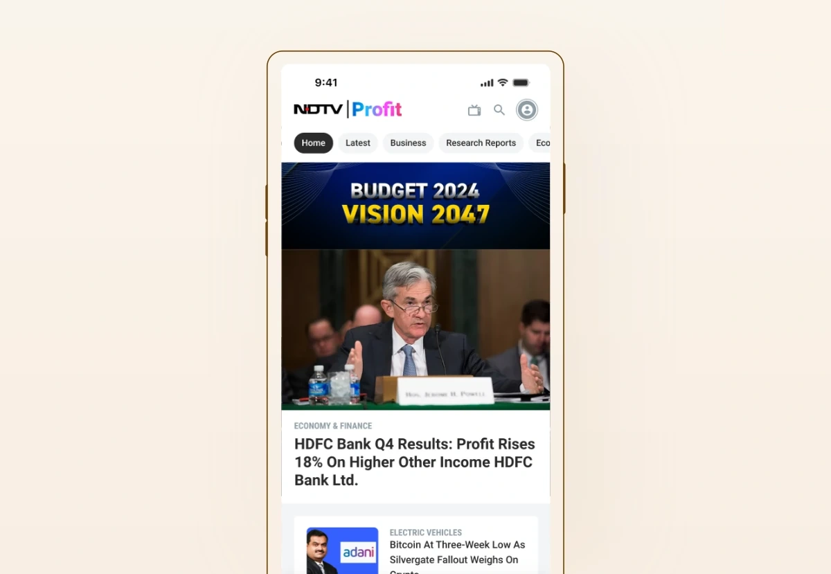 The NDTV Profit app home feed, with a Budget and Vision hero card above the day's business and market stories